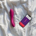 Вибромассажер для стимуляции зоны G и преддверия влагалища с гнущимся стволом и 2 моторами We-Vibe Rave 2 с управлением со смартфона - фуксия - 21,7 см